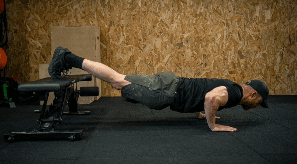 Flexión con pies elevados